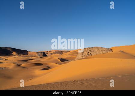 view in the Sahara desert of Tadrart rouge tassili najer in Djanet City  ,Algeria.colorful orange sand, rocky mountains Stock Photo