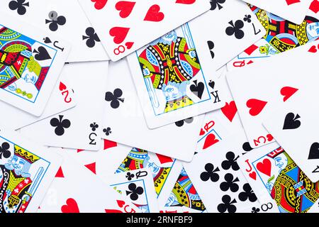 Flat Pile of Gambling Paying Cards Background Close Up. Stock Photo