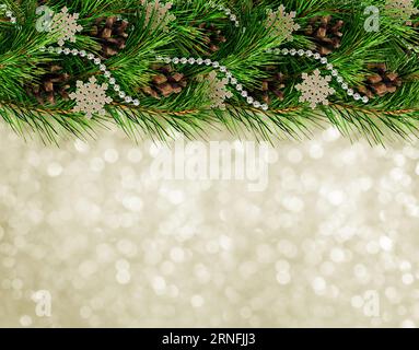 Christmas garland with pine twigs and cones on silver bokeh background Stock Photo