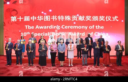 (160823) -- BEIJING, Aug. 23, 2016 -- Chinese Vice Premier Liu Yandong (C, front) poses for a group photo with winners of the 10th Special Book Award of China in Beijing, capital of China, Aug. 23, 2016. ) (yxb) CHINA-BEIJING-LIU YANDONG-SPECIAL BOOK AWARD (CN) MaxZhancheng PUBLICATIONxNOTxINxCHN   160823 Beijing Aug 23 2016 Chinese Vice Premier Liu Yandong C Front Poses for a Group Photo With winners of The 10th Special Book Award of China in Beijing Capital of China Aug 23 2016 yxb China Beijing Liu Yandong Special Book Award CN MaxZhancheng PUBLICATIONxNOTxINxCHN Stock Photo