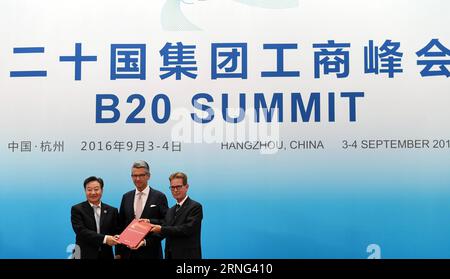 (160904) -- HANGZHOU, Sept. 4, 2016 -- Jiang Zengwei (L), chair of the Business 20 (B20) China and also chairman of the China Council for the Promotion of International Trade, hands over a document to the representatives of the next B20 summit host Ulrich Grillo (C), president of the Federation of German Industries, and Gerhard Braun, vice-president of Confederation of German Employers Associations, in Hangzhou, capital of east China s Zhejiang Province, Sept. 4, 2016. The B20 summit concluded in Hangzhou on Sunday. )(zkr) (G20 SUMMIT)CHINA-HANGZHOU-B20-CONCLUSION (CN) ChenxYehua PUBLICATIONxN Stock Photo