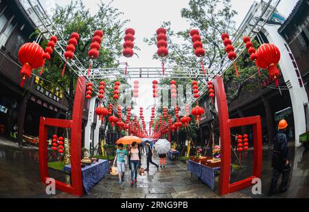 (160915) -- HANGZHOU, Sept. 15, 2016 -- Tourists view rice flour sculptures during the Mid-Autumn Festival in Tangqi ancient town of Hangzhou, east China s Zhejiang Province, Sept. 15, 2016. It is a folk custom for local people to greet the Mid-Autumn Festival by making rice flour sculptures. ) (zhs) CHINA-HANGZHOU-MID-AUTUMN FESTIVAL-CUSTOM (CN) XuxYu PUBLICATIONxNOTxINxCHN   160915 Hangzhou Sept 15 2016 tourists View Rice Flour Sculptures during The Mid Autumn Festival in Tangqi Ancient Town of Hangzhou East China S Zhejiang Province Sept 15 2016 IT IS a Folk Custom for Local Celebrities to Stock Photo