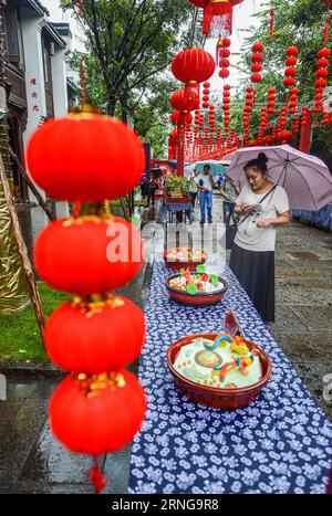 (160915) -- HANGZHOU, Sept. 15, 2016 -- Tourists view rice flour sculptures during the Mid-Autumn Festival in Tangqi ancient town of Hangzhou, east China s Zhejiang Province, Sept. 15, 2016. It is a folk custom for local people to greet the Mid-Autumn Festival by making rice flour sculptures. ) (zyd) CHINA-HANGZHOU-MID-AUTUMN FESTIVAL-CUSTOM (CN) XuxYu PUBLICATIONxNOTxINxCHN   160915 Hangzhou Sept 15 2016 tourists View Rice Flour Sculptures during The Mid Autumn Festival in Tangqi Ancient Town of Hangzhou East China S Zhejiang Province Sept 15 2016 IT IS a Folk Custom for Local Celebrities to Stock Photo