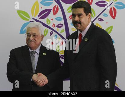 (160918) -- MARGARITA (VENEZUELA), Sept. 17, 2016 -- Venezuela s President Nicolas Maduro (R) greets his Palestinian counterpart Mahmoud Abbas at the Hugo Chavez Frias Convention Center in Margarita Island, Venezuela, on Sept. 17, 2016. Iran officially handed over the three-year rotating presidency of the Non-Aligned Movement (NAM) to Venezuela at the 17th NAM Summit held Saturday in Venezuela s Margarita Island. Boris Vergara) (egp) (fnc)(yy) VENEZUELA-MARGARITA-NAM-SUMMIT e BorisxVergara PUBLICATIONxNOTxINxCHN   Margarita Venezuela Sept 17 2016 Venezuela S President Nicolas Maduro r greets H Stock Photo