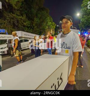 Haifa, Israel - August 31, 2023: People carry symbolic coffins, part of the march of the dead protest against rising violence and murder rate in the A Stock Photo