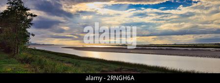 Sunset over Cobequid Bay. An inlet of the Bay of Fundy and the easternmost part of the Minas Basin, located in the Canadian province of Nova Scotia. Stock Photo