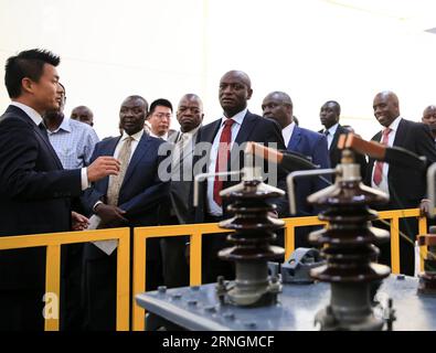 (161006) -- NAIROBI, Oct. 6, 2016 -- Charles Keter (C), Kenya s Cabinet Secretary for Energy and Petroleum, visits Yocean manufacturing transformers factory on the outskirts of Nairobi, Kenya, on Oct. 5, 2016. Kenya s first transfomer-manufacturing plant, set up by Chinese company Yocean Group, opened on Wednesday. Kenya has been relying on transformers from abroad, mostly from India. Kenya s Cabinet Secretary for Energy and Petroleum, Charles Keter, said the plant will ease procurement of transformers and other electrical appliances.) (dtf) KENYA-NAIROBI-ENERGY-CHINA-TRANSFORMER PanxSiwei PUB Stock Photo