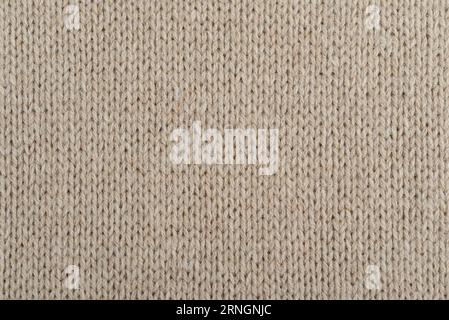 Beige handmade Knitted Fabric Texture from angora yarn Stock Photo