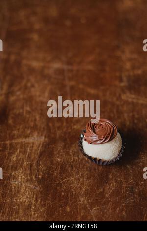 single chocolate truffle at the table Stock Photo