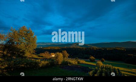 Picturesque village of Reber in dolenjska region of Slovenia on a sunny evening sunset,with visible typical small houses or weekend homes called Zidan Stock Photo