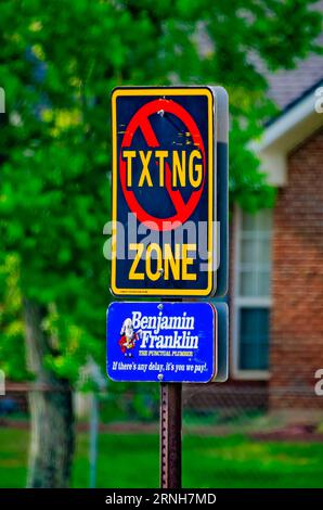 A “no texting zone” sign stands in front of Foley Elementary School, Aug. 19, 2023, in Foley, Alabama. Stock Photo