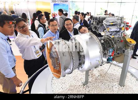 (161102) -- ZHUHAI, Nov. 2, 2016 -- Visitors look at China s first self-developed turboshaft engine on Zhuhai Airshow of south China s Guangdong Province, Nov. 2, 2016. ) (wyl) CHINA-ZHUHAI-AIRSHOW-TURBOSHAFT ENGINE (CN) LixHe PUBLICATIONxNOTxINxCHN   Zhuhai Nov 2 2016 Visitors Look AT China S First Self Developed Turboshaft Engine ON Zhuhai Airshow of South China S Guangdong Province Nov 2 2016 wyl China Zhuhai Airshow Turboshaft Engine CN LixHe PUBLICATIONxNOTxINxCHN Stock Photo