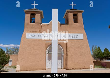 White crosses of San Francisco de Asis Catholic mission church in Taos New Mexico Stock Photo