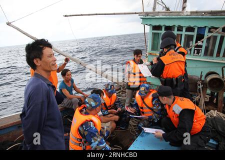 HAIKOU, Coast guards from China and Vietnam inspect a Vietnamese fishing boat in a common fishing zone in the Beibu Gulf, Nov. 8, 2016. China and Vietnam concluded a three-day joint patrol mission in a common fishing zone in the Beibu Gulf Wednesday. Coast guards from both sides completed a series of scheduled tasks, including a joint patrol, maritime search and rescue exercise, and examination of fishing boats, amid strong winds and high waves, according to a China Coast Guard (CCG) statement. ) (zkr) CHINA-VIETNAM-JOINT PATROL-BEIBU GULF(CN) BaixGuolong PUBLICATIONxNOTxINxCHN   Haikou Coast Stock Photo