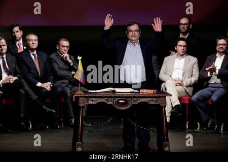 Kolumbien schließt neues Abkommen mit FARC-Guerilla (161124) -- BOGOTA, Nov. 24, 2016 -- The leader of the Revolutionary Armed Forces of Colombia (FARC), Rodrigo Londono (front), participates in the signing ceremony of a revised peace agreement between the Colombian government and the FARC at Colon Theater in Bogota, capital of Colombia, on Nov. 24, 2016. Colombian President Juan Manuel Santos and Rodrigo Londono signed a revised peace agreement here on Thursday. This revised agreement will be sent to Congress. ) COLOMBIA-BOGOTA-GOVERNMENT-FARC-REVISED PEACE AGREEMENT-SIGNING JhonxPaz PUBLICAT Stock Photo