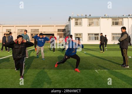 (161213) -- BEIJING, Dec. 13, 2016 -- Zhang Zhixiang (1st R) trains students on China s first standard rugby field at China Agricultural University (CAU) in Beijing, capital of China, Nov. 24, 2016. Zhang Zhiqiang, who is considered China s most successful rugby player, is the coach of CAU rugby team. Under Zhang s guidance, the team took the championship last month at the national college rugby sevens tournament in Zhuhai, south China s Guangdong Province. ) (mp) CHINA-BEIJING-RUGBY-ZHANG ZHIQIANG (CN) WuxKaixiang PUBLICATIONxNOTxINxCHN   Beijing DEC 13 2016 Zhang  1st r Trains Students ON Ch Stock Photo