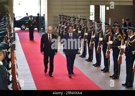 (161216) -- TOKYO, Dec. 16, 2016 () -- Russian President Vladimir Putin (center L) and Japanese Prime Minister Shinzo Abe (center R) review an honor guard at Abe s official residence in Tokyo, Japan, Dec. 16, 2016. Russian President Vladimir Putin said on Friday that the isles row between Russia and Japan can not be solved soon. () (cl) JAPAN-TOKYO-RUSSIA-PUTIN-ABE Xinhua PUBLICATIONxNOTxINxCHN   Tokyo DEC 16 2016 Russian President Vladimir Putin Center l and Japanese Prime Ministers Shinzo ABE Center r REVIEW to HONOR Guard AT ABE S Official Residence in Tokyo Japan DEC 16 2016 Russian Presid Stock Photo