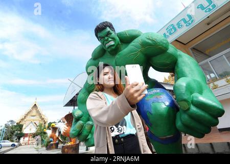 A woman takes selfie with a Hulk statue at the Wat Tam Ru temple in central Thailand s Samut Prakan Province, Jan. 11, 2017. In order to encourage youngsters to visit Wat Tam Ru and learn Buddhist teachings, the abbot decided to change the temple s outlook by adding elements of modern pop culture. Eventually, the statues of a number of comic-book figures, including Iron Man, Hulk and Superman, have been introduced to this place of worship. ) (hy) THAILAND-SAMUT PRAKAN-BUDDHISM-TEMPLE-COMIC RachenxSageamsak PUBLICATIONxNOTxINxCHN   a Woman Takes Selfie With a Hulk Statue AT The Wat Tam RU Templ Stock Photo