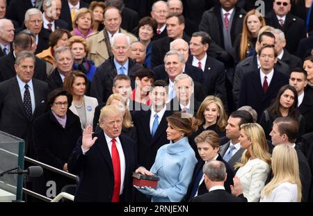 Amtseinführung von Donald Trump: Amtseid vor dem Capitol (170120) -- WASHINGTON, Jan. 20, 2017 -- U.S. President Donald Trump(1st L, front row) takes the oath of office during the presidential inauguration ceremony at the U.S. Capitol in Washington D.C., the United States, on Jan. 20, 2017. Donald Trump was sworn in on Friday as the 45th President of the United States. ) U.S.-WASHINGTON D.C.-PRESIDENT-INAUGURATION CEREMONY-DONALD TRUMP YinxBogu PUBLICATIONxNOTxINxCHN   Inauguration from Donald Trump Oath of office before the Capitol  Washington Jan 20 2017 U S President Donald Trump 1st l Fron Stock Photo