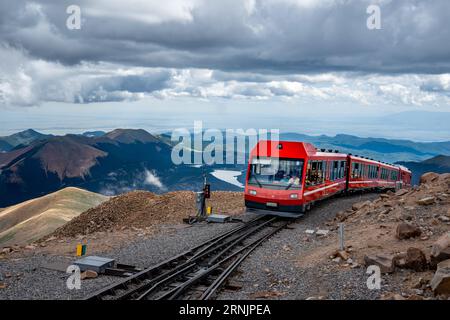 Pikes Peak cog railway at summit - view of clouds rocks and landscape of Pike's Peak State Park Rocky Mountains Colorado Springs railroad in Summer Stock Photo