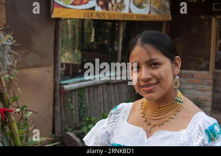 columbus day. foreground . copyspace of pretty indigenous woman from ecuador in traditional dress Stock Photo