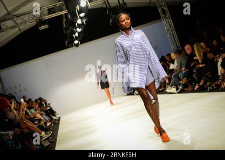 (170328) -- JOHANNESBURG, March 28, 2017 -- Models present creations by designer Thebe Magugu on the opening day of South African Fashion Week Spring Summer 2017 at Hyde Park Corner in Johannesburg, South Africa, on March 28, 2017. The South African Fashion Week Spring Summer 2017 kicked off here Tuesday. Creations by more than 60 South African and international fashion designers or brands are scheduled to be presented in the five-day event. ) SOUTH AFRICA-JOHANNESBURG-FASHION WEEK-OPENING ZhaixJianlan PUBLICATIONxNOTxINxCHN   Johannesburg March 28 2017 Models Present Creations by Designers Th Stock Photo