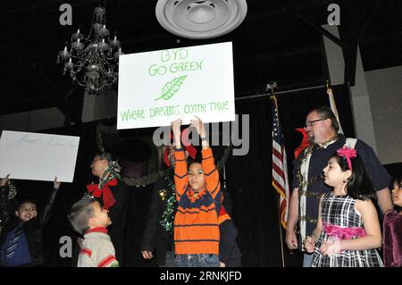 (170405) -- NEW YORK, April 5, 2017 -- Local staff and their family members take part in a Christmas party held by BYD, a Chinese automobile manufacturer, at BYD s Lancaster factory in California, the United States, on Dec. 9, 2016. Apart from the contributions to the local economy and job opportunities, Chinese enterprises have made continuous efforts in education projects, charity events and community works in the United States in the past years. ) (gl) U.S.-CHINESE ENTERPRISE HuangxZhe PUBLICATIONxNOTxINxCHN   New York April 5 2017 Local Staff and their Family Members Take Part in a Christm Stock Photo