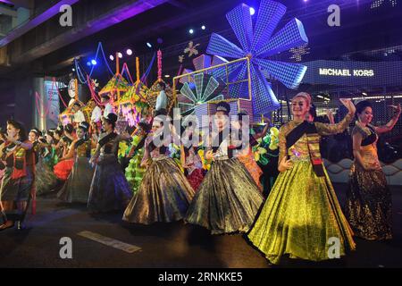 (170409) -- BANGKOK, April 9, 2017 -- Performers dance during the Amazing Songkran Joyful Procession in Bangkok, Thailand, April 8, 2017. The celebration of Songkran kicked off on Saturday as the Amazing Songkran Joyful Procession took place in downtown Bangkok. The event, held by the Tourism Authority of Thailand, presented the audience with street performances and festive floats that offered a glimpse into the country s Songkran culture. Songkran festival, or the Thai New Year, lasts from April 13 to 15. ) (hy) THAILAND-BANGKOK-SONGKRAN FESTIVAL-CELEBRATION-PROCESSION LixMangmang PUBLICATION Stock Photo