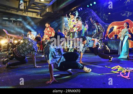 (170409) -- BANGKOK, April 9, 2017 -- Performers dance during the Amazing Songkran Joyful Procession in Bangkok, Thailand, April 8, 2017. The celebration of Songkran kicked off on Saturday as the Amazing Songkran Joyful Procession took place in downtown Bangkok. The event, held by the Tourism Authority of Thailand, presented the audience with street performances and festive floats that offered a glimpse into the country s Songkran culture. Songkran festival, or the Thai New Year, lasts from April 13 to 15. ) (hy) THAILAND-BANGKOK-SONGKRAN FESTIVAL-CELEBRATION-PROCESSION LixMangmang PUBLICATION Stock Photo