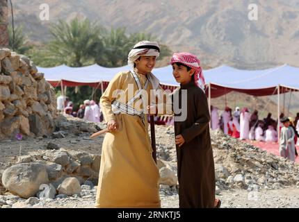 (170419) -- DUBAI, April 19, 2017 -- Two boys play near the site of a traditional wedding ceremony on mountain Jebal Jais in Ras Al Khaimah, United Arab Emirates (UAE), March 10, 2017. The UAE, located at the intersection of the Belt and Road Initiative, is an important partner for China to promote the Belt and Road Initiative. )(gl) UAE-BELT AND ROAD INITIATIVE-SCENERY LixZhen PUBLICATIONxNOTxINxCHN   Dubai April 19 2017 Two Boys Play Near The Site of a Traditional Wedding Ceremony ON Mountain  Jais in Ras Al Khaimah United Arab Emirates UAE March 10 2017 The UAE Located AT The intersection o Stock Photo