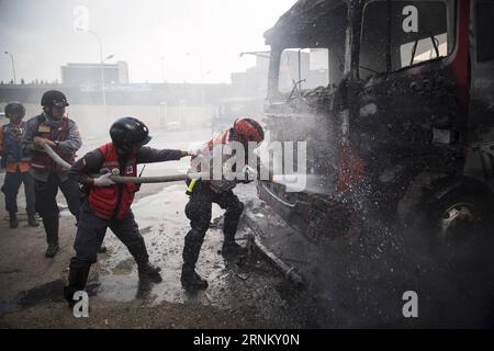 (170425) -- CARACAS, April 25, 2017 -- Firemen extinguish flames during a protest in Caracas, Venezuela, on April 24, 2017. Venezuelan Foreign Minister Delcy Rodriguez on Saturday called for true and accessible global media coverage of the recent situation in the country. Since April 1, Venezuela has seen intense protests by both government and opposition supporters in Caracas and across the country, which have claimed at least 15 lives. Boris Vergara) (da) (rtg) (yy) VENEZUELA-CARACAS-PROTEST e FranciscoxBruzco PUBLICATIONxNOTxINxCHN   Caracas April 25 2017 firemen extinguisher Flames during Stock Photo