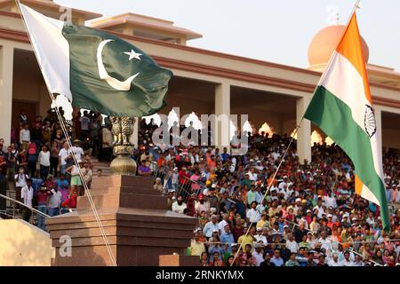 (170426) -- LAHORE, April 26, 2017 -- A Pakistani national flag (L) and an Indian national flag are seen during a flag lowering ceremony at Wagah border between Pakistan and India in eastern Pakistan s Lahore, April 26, 2017. The daily flag lowering ceremony attracts many visitors from both Pakistan and India. ) (zjy) PAKISTAN-LAHORE-WAGAH BORDER-FLAG LOWERING CEREMONY AhmadxKamal PUBLICATIONxNOTxINxCHN   Lahore April 26 2017 a Pakistani National Flag l and to Indian National Flag are Lakes during a Flag Lowering Ceremony AT Wagah Border between Pakistan and India in Eastern Pakistan S Lahore Stock Photo