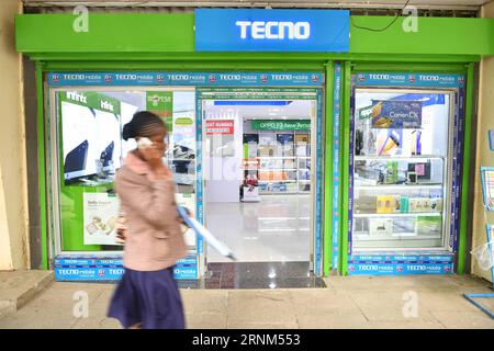 (170510) -- NAIROBI, May 10, 2017 -- A pedestrian walks past a mobile phone shop in downtown Nairobi, capital of Kenya, May 9, 2017. Chinese mobile phone manufacturer Tecno Mobile sales reached 25 million devices, including 9 million smartphones in 2015, helping it to sustain the most popular brand status in Africa. ) (jmmn) KENYA-NAIROBI-CHINESE MOBILE PHONE SunxRuibo PUBLICATIONxNOTxINxCHN   Nairobi May 10 2017 a Pedestrian Walks Past a Mobile Phone Shop in Downtown Nairobi Capital of Kenya May 9 2017 Chinese Mobile Phone Manufacturer Tecno Mobile Sales reached 25 Million Devices including 9 Stock Photo