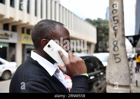 (170510) -- NAIROBI, May 10, 2017 -- A man uses Tecno mobile phone in downtown Nairobi, capital of Kenya, May 9, 2017. Chinese mobile phone manufacturer Tecno Mobile sales reached 25 million devices, including 9 million smartphones in 2015, helping it to sustain the most popular brand status in Africa. ) (jmmn) KENYA-NAIROBI-CHINESE MOBILE PHONE SunxRuibo PUBLICATIONxNOTxINxCHN   Nairobi May 10 2017 a Man Uses Tecno Mobile Phone in Downtown Nairobi Capital of Kenya May 9 2017 Chinese Mobile Phone Manufacturer Tecno Mobile Sales reached 25 Million Devices including 9 Million Smartphones in 2015 Stock Photo