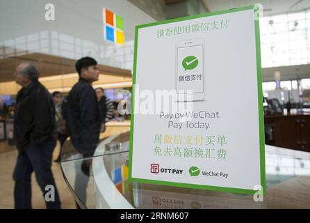 (170512) -- TORONTO, May 12, 2017 -- A WeChat Pay logo is seen on a desk of service centre at Yorkdale Shopping Centre in Toronto, Canada, May 11, 2017. Canada s shopping mall Yorkdale Shopping Centre started accepting China s WeChat Pay from May 2017. Tourism Toronto and OTT Financial Group have introduced the Chinese mobile payment service, WeChat Pay, into local tourism to boost travel and shopping consumption by Chinese travelers.)(gj) CANADA-TORONTO-WECHAT PAY ZouxZheng PUBLICATIONxNOTxINxCHN Stock Photo