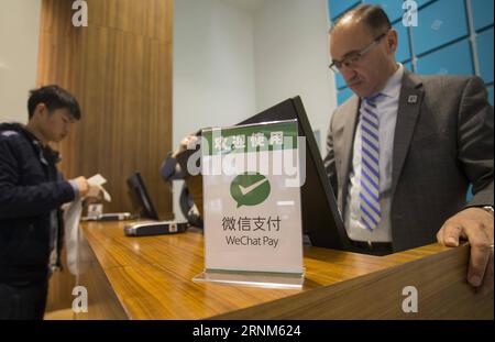 (170512) -- TORONTO, May 12, 2017 -- A WeChat Pay logo is seen on a cashier desk of a shop at Yorkdale Shopping Centre in Toronto, Canada, May 11, 2017. Canada s shopping mall Yorkdale Shopping Centre started accepting China s WeChat Pay from May 2017. Tourism Toronto and OTT Financial Group have introduced the Chinese mobile payment service, WeChat Pay, into local tourism to boost travel and shopping consumption by Chinese travelers.)(gj) CANADA-TORONTO-WECHAT PAY ZouxZheng PUBLICATIONxNOTxINxCHN Stock Photo
