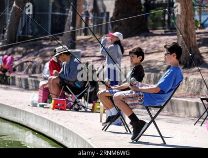 (170514) -- LOS ANGELES, May 14, 2017 -- Children participate in fish training during a youth fishing derby held by the Los Angeles Department of Recreation and Parks in the lake at MacArthur Park near downtown Los Angeles, the United States, on May 13, 2017. )(gj) U.S.-LOS ANGELES-FISHING ZhaoxHanrong PUBLICATIONxNOTxINxCHN   Los Angeles May 14 2017 Children participate in Fish Training during a Youth Fishing Derby Hero by The Los Angeles Department of Recreation and Parks in The Lake AT MacArthur Park Near Downtown Los Angeles The United States ON May 13 2017 GJ U S Los Angeles Fishing Zhaox Stock Photo