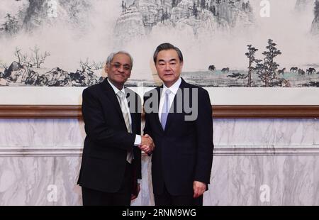 (170518) -- BEIJING, May 18, 2017 -- Chinese Foreign Minister Wang Yi (R) meets with his Mauritian counterpart Vishnu Lutchmeenaraidoo, in Beijing, capital of China, May 17, 2017. ) (zwx) CHINA-BEIJING-WANG YI-MAURITIUS-MEETING (CN) JinxLiangkuai PUBLICATIONxNOTxINxCHN   Beijing May 18 2017 Chinese Foreign Ministers Wang Yi r Meets With His Mauritian Part Vishnu  in Beijing Capital of China May 17 2017 zwx China Beijing Wang Yi Mauritius Meeting CN JinxLiangkuai PUBLICATIONxNOTxINxCHN Stock Photo