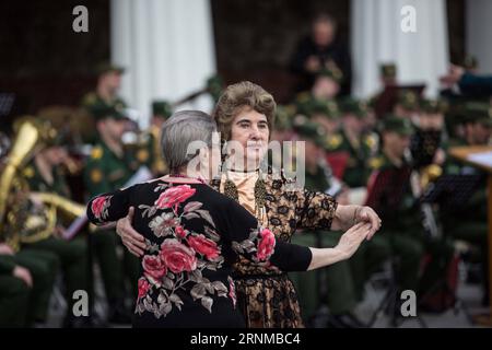 (170520) -- MOSCOW, May 20, 2017 -- People dance with the music at the opening of the Army Bands in the Parks concert program in Moscow, Russian, May 20, 2017. ) RUSSIA-MOSCOW-MILITARY BAND-CONCERT WuxZhuang PUBLICATIONxNOTxINxCHN   Moscow May 20 2017 Celebrities Dance With The Music AT The Opening of The Army Bands in The Parks Concert Program in Moscow Russian May 20 2017 Russia Moscow Military Tie Concert WuxZhuang PUBLICATIONxNOTxINxCHN Stock Photo