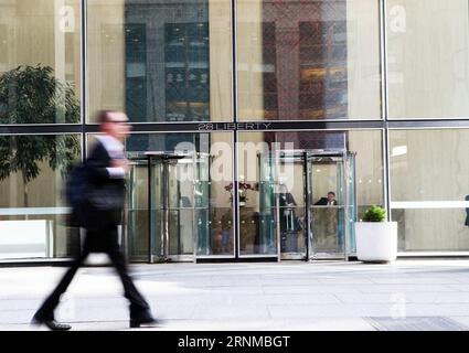 (170520) -- NEW YORK, May 20, 2017 -- A man walks past 28 Liberty, a property purchased by Chinese investment company Fosun in downtown Manhattan, New York, the United States on May 15, 2017. 28 Liberty Street in the downtown Manhattan Financial District, formerly known as One Chase Manhattan Plaza, now houses U.S. headquarters of Fosun, a Chinese investment company. Fosun purchased the building from J.P.Morgan for $725 million U.S. dollars in 2013 and renamed it as 28 Liberty. Fosun has made a total of 3 billion dollars investment in the United States since 2012, supporting about 8,000 local Stock Photo