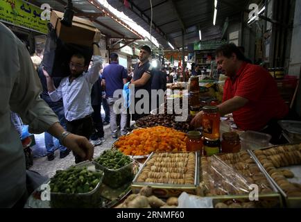 (170525) -- NABLUS, May 25, 2017 -- Palestinians shop in a market ahead of the Muslim fasting month of Ramadan, in the West Bank City of Nablus, on May 25, 2017. Ayman Nobani) MIDEAST-NABLUS-RAMADAN-PREPARATION zhaoyue PUBLICATIONxNOTxINxCHN   Nablus May 25 2017 PALESTINIANS Shop in a Market Ahead of The Muslim fasting Month of Ramadan in The WEST Bank City of Nablus ON May 25 2017 Ayman Nobani Mideast Nablus Ramadan Preparation  PUBLICATIONxNOTxINxCHN Stock Photo