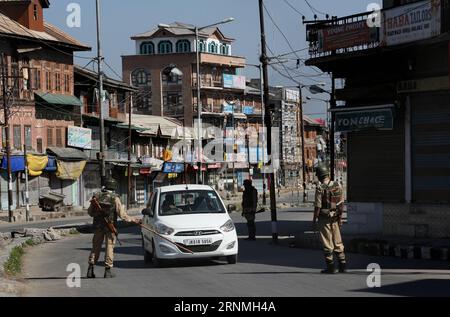 (170529) -- SRINAGAR, May 29, 2017 -- Indian paramilitary troopers stop a car during curfew-like restrictions in downtown Srinagar, summer capital of Indian-controlled Kashmir, May 29, 2017. Curfew-like restrictions have been imposed in several areas of Srinagar to prevent protests and clashes. ) (zcc) KASHMIR-SRINAGAR-RESTRICTIONS JavedxDar PUBLICATIONxNOTxINxCHN   Srinagar May 29 2017 Indian paramilitary Troopers Stop a Car during Curfew Like Restrictions in Downtown Srinagar Summer Capital of Indian Controlled Kashmir May 29 2017 Curfew Like Restrictions have been imposed in several Areas o Stock Photo
