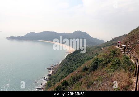 (170601) -- HONG KONG, June 1, 2017 -- People walk along the Lantau Trail in Hong Kong, south China, Feb. 2, 2013. )(mcg) CHINA-HONG KONG-MOUNTAIN PATH-DAILY LIFE (CN) LixPeng PUBLICATIONxNOTxINxCHN   Hong Kong June 1 2017 Celebrities Walk Along The Lantau Trail in Hong Kong South China Feb 2 2013 McG China Hong Kong Mountain Path Daily Life CN LixPeng PUBLICATIONxNOTxINxCHN Stock Photo