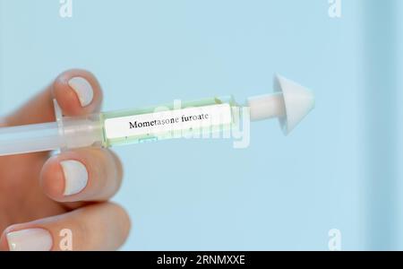 Mometasone furoate: A corticosteroid used to treat symptoms of allergic rhinitis, such as congestion, sneezing, and itching. Stock Photo