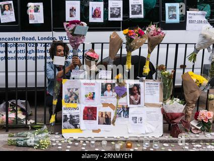 (170616) -- LONDON, June 16, 2017 -- Floral tributes and messages for the victims of Grenfell Tower are seen in London, Britain, on June 16, 2017. London s Metropolitan Police confirmed Friday that at least 30 people died in this week s fire which swept through a residential tower block in west London. Although police did not speculate on the eventual number of fatalities, local community sources say at least 70 from Grenfell Tower are still missing, including entire families. ) BRITAIN-LONDON-GRENFELL TOWER-FIRE-AFTERMATH RayxTang PUBLICATIONxNOTxINxCHN   170616 London June 16 2017 floral Tri Stock Photo