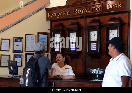 (170619) -- GRANMA, June 19, 2017 -- A receptionist talks to a guest in a hotel in Granma Province, Cuba, June 9, 2017. Beyond pristine beaches and radiant sunshine almost the whole year round, Cuba harbors a historic treasure, which it now seeks to exploit as a tourist attraction. Granma, a province located about 675 km east of Havana, has been the stage for important events in Cuban history. As a consequence, it enjoys multiple locations that may be of interest to tourists seeking a touch of culture. ) (djj) CUBA-GRANMA-TOURISM-FEATURE JoaquinxHernandez PUBLICATIONxNOTxINxCHN   Granma June 1 Stock Photo