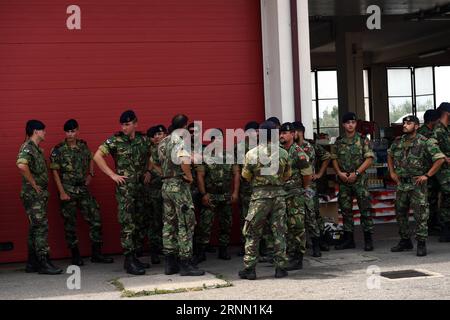 (170620) -- PEDROGAO GRANDE, June 20, 2017 -- Portuguese soldiers gather at the Fire Department in the area of Pedrogao Grande, some 150 km northeast of Lisbon, Portugal, on June 19, 2017. By Monday, 64 people including a young fire fighter were killed and 135 others were injured in the fires which erupted in Pedrogao Granda on Saturday and quickly spread into neighboring towns, making it the biggest tragedy in Portugal in more than four decades, as President Marcelo Rebelo de Sousa stated. ) (gj) PORTUGAL-FIRE-RELIEF ZhangxLiyun PUBLICATIONxNOTxINxCHN   Pedrogao Grande June 20 2017 PORTUGUESE Stock Photo