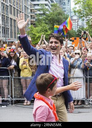 (170626) -- TORONTO, June 26, 2017 -- Canadian Prime Minister Justin Trudeau (C) waves to people during the 2017 Pride Parade in Toronto, Canada, June 25, 2017. ) (jmmn) CANADA-TORONTO-PRIDE PARADE ZouxZheng PUBLICATIONxNOTxINxCHN   Toronto June 26 2017 Canadian Prime Ministers Justin Trudeau C Waves to Celebrities during The 2017 Pride Parade in Toronto Canada June 25 2017 jmmn Canada Toronto Pride Parade ZouxZheng PUBLICATIONxNOTxINxCHN Stock Photo