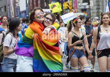 (170626) -- TORONTO, June 26, 2017 -- Two women hug during the 2017 Pride Parade in Toronto, Canada, June 25, 2017. ) (jmmn) CANADA-TORONTO-PRIDE PARADE ZouxZheng PUBLICATIONxNOTxINxCHN   Toronto June 26 2017 Two Women Hug during The 2017 Pride Parade in Toronto Canada June 25 2017 jmmn Canada Toronto Pride Parade ZouxZheng PUBLICATIONxNOTxINxCHN Stock Photo