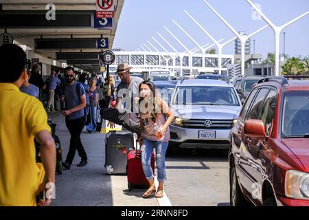 (170701) -- LOS ANGELES, July 1, 2017 -- Travelers arrive at Los Angeles International Airport, the United States, June 30, 2017. Holiday travel will increase on this Independence Day weekend, and the number of travelers from California will exceed 5 million, according to the Automobile Club of Southern California. )(zcc) U.S.-LOS ANGELES-HOLIDAY-TRAVEL ZhaoxHanrong PUBLICATIONxNOTxINxCHN   Los Angeles July 1 2017 Travelers Arrive AT Los Angeles International Airport The United States June 30 2017 Holiday Travel will Increase ON This Independence Day Weekend and The Number of Travelers from Ca Stock Photo